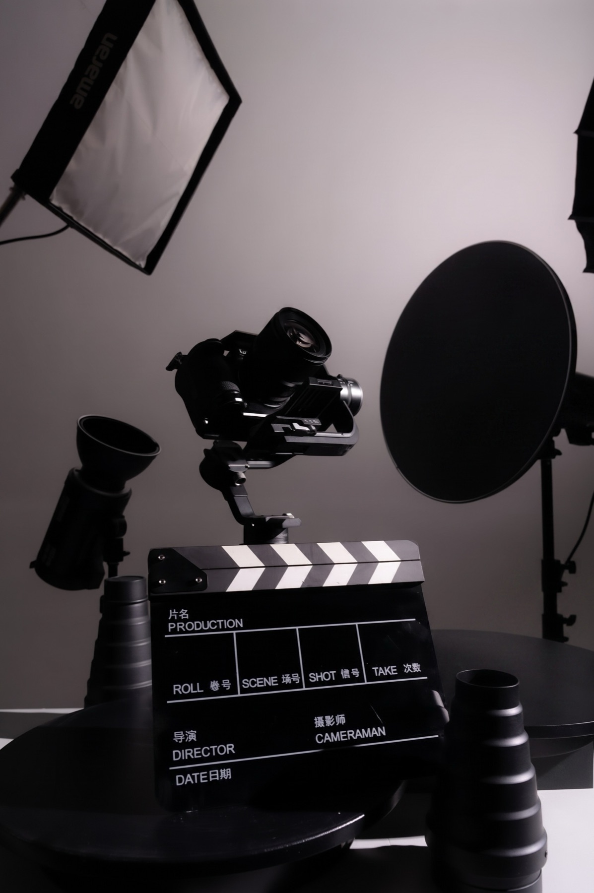 Camera on stand with softbox, ring light and clapperboard